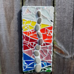 Grow Abstract mosaic of sea grass made of stones growing through layers of water represented by different colored glass, green, blue, purple, red, orange, yellow, and clear