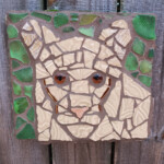 Sakata An 8 inch wide by 7.25 inch high mosaic depicting a Florida panther, created from repurposed dinnerware, beach glass, reclaimed wood, and glass beads.
